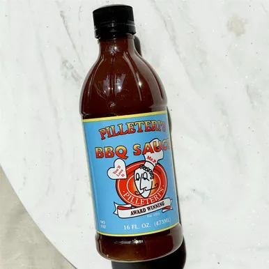 An overhead view of a single bottle of Pilleteri's BBQ Sauce.