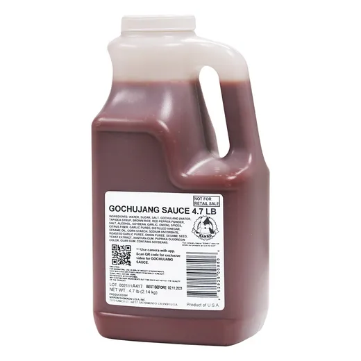 A large bulk jug of Gochujang sauce.