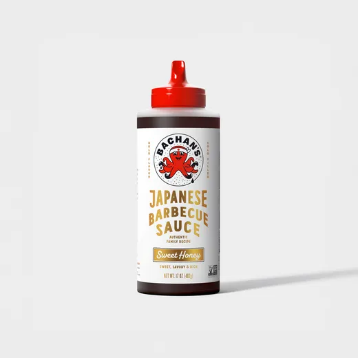 A bottle of Bachan's Japanese Barbecue Sauce in Sweet Honey flavor, isolated on a white background.
