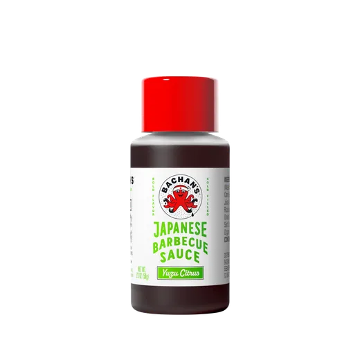 A small bottle of Bachan's Yuzu Citrus Japanese Barbecue Sauce against a black background.
