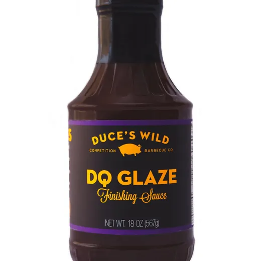 A front view of a bottle of Duce's Wild DQ Glaze Finishing Sauce.