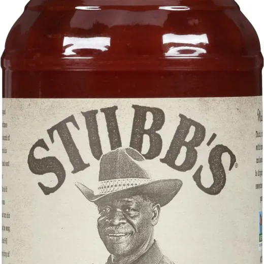 A clear bottle of Stubb's Sticky Sweet barbecue sauce.