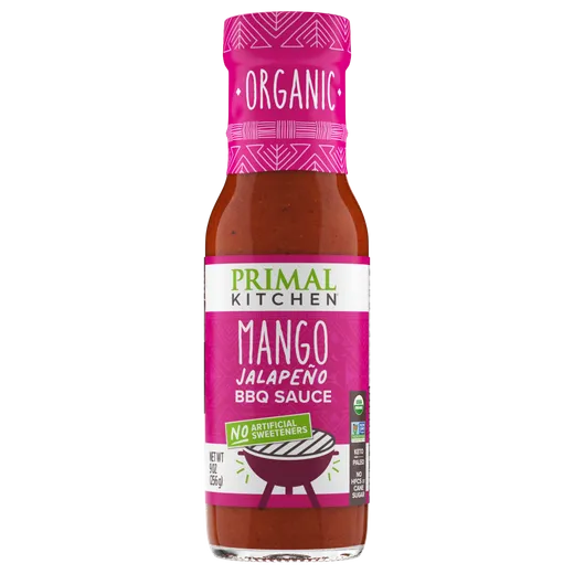 A bottle of Primal Kitchen Mango Jalapeño BBQ Sauce on a white background.