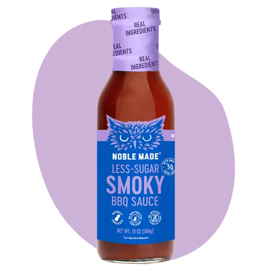 A bottle of Noble Made smoky BBQ sauce against a soft purple background.