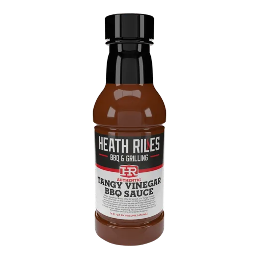 A front view of a bottled Heath Riles Tangy Vinegar BBQ Sauce.