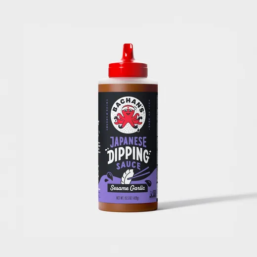 A bottle of Bachan's Japanese Sesame Garlic Dipping Sauce stands on a plain background.