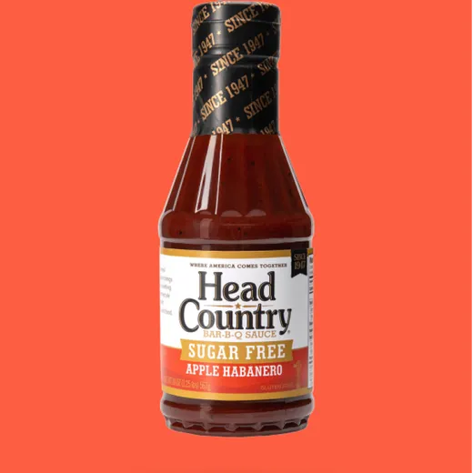 A bottle of Head Country sugar-free apple habanero BBQ sauce.