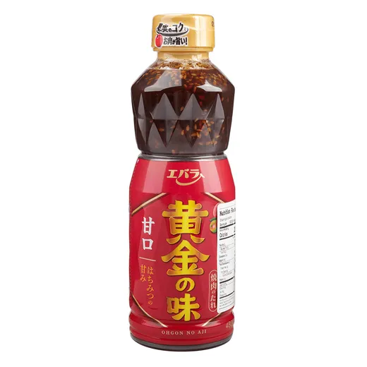 A full bottle of sweet BBQ sauce against a white background.